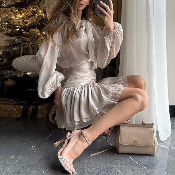 Sheer Bow Blouse and Pleated Mini Skirt in Soft Taupe